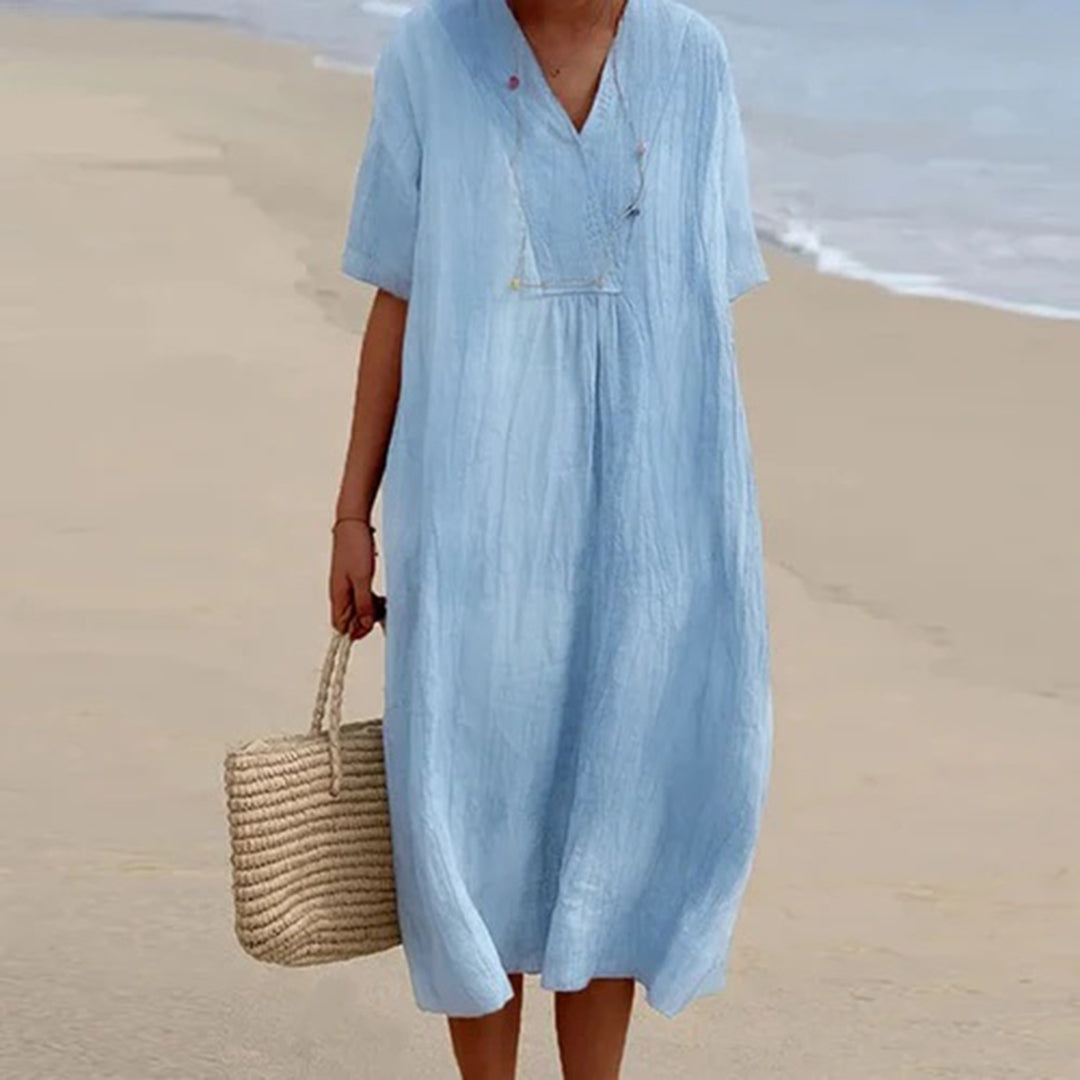 Abito midi da donna casual-elegante, vestibilità rilassata, perfetto per vacanze estive e serate sofisticate.