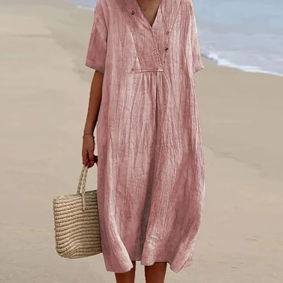 Abito midi donna elegante-casual per vacanze estive. Vestito versatile, rilassato e alla moda femminile.