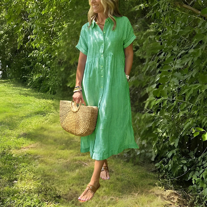 Elegante abito midi donna a righe verticali, ideale per occasioni casual o più formali.