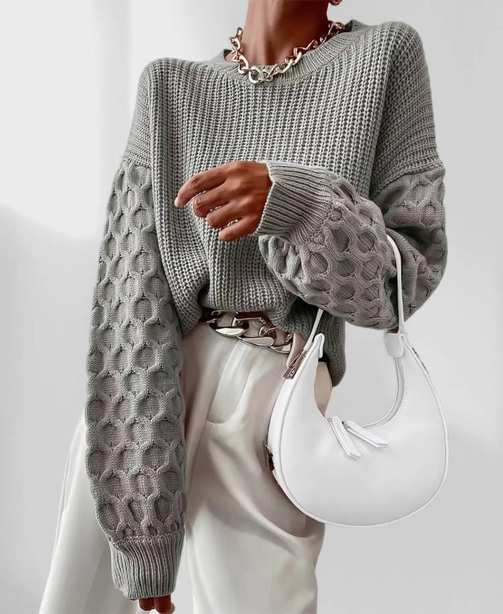 Confortevole maglione donna autunnale con maniche a lanterna, perfetto per un look casual-chic quotidiano.