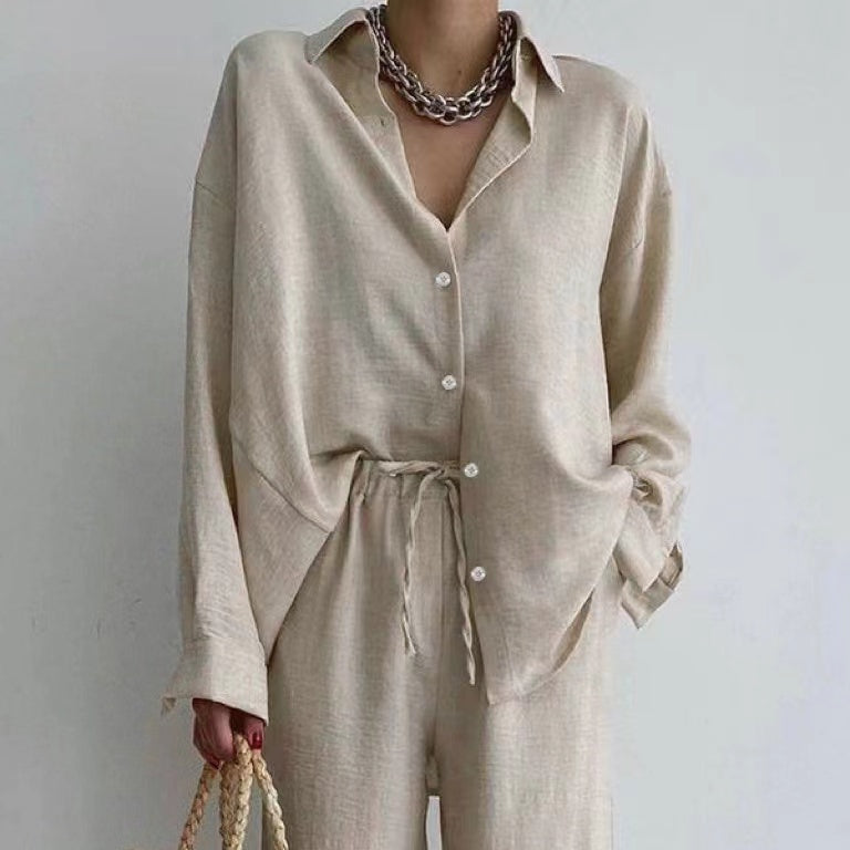 Set blusa larga e pantaloni a gamba larga donna. Outfit autunnale casual ed elegante con vita regolabile.