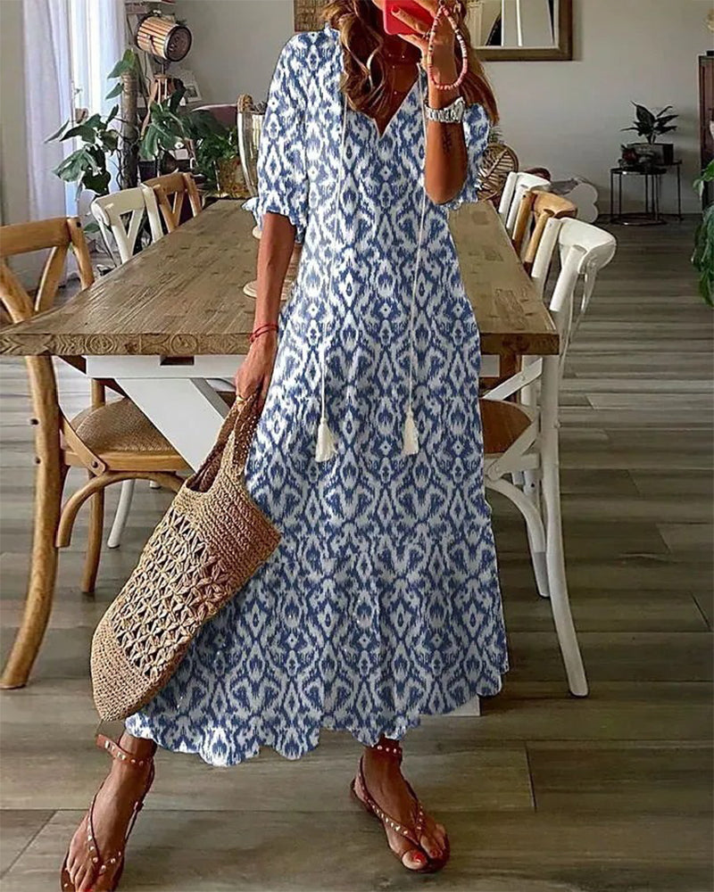 Abito midi donna elegante, stampa geometrica, scollo a V, maniche a lanterna. Perfetto per l'estate.