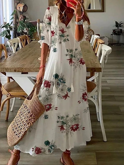 Abito midi donna scollo a V, stampa geometrica. Maniche a lanterna. Perfetto per un look casual o elegante.