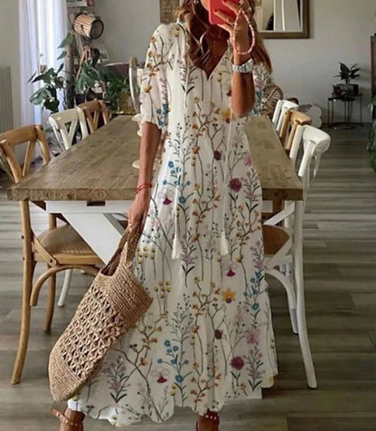 Tendenza moda estiva: abito midi donna stampa geometrica. Scollo a V e maniche a lanterna per stile unico.
