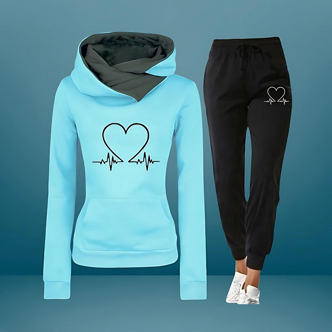 Completo sportivo donna, felpa con cappuccio e pantaloni. Versatile per fitness, casa o stile streetwear.
