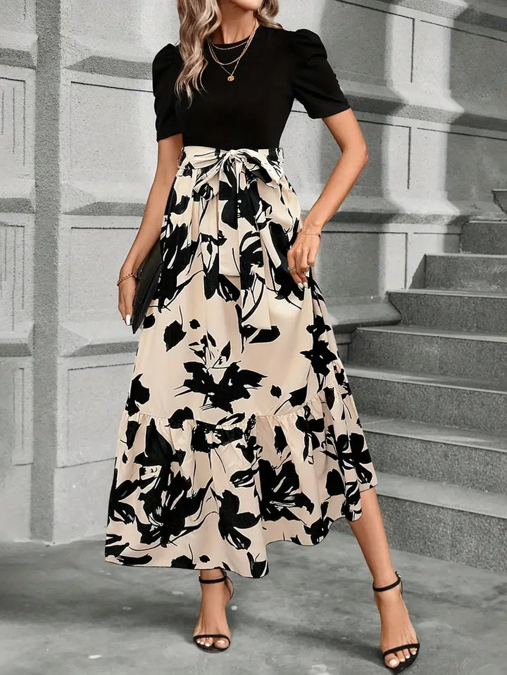 Abito donna estivo/primaverile lungo ed elegante con fiocco in vita, ideale per feste o occasioni speciali.