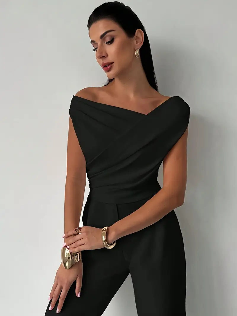Top donna grigio melange con spalle drappeggiate. Girocollo, maniche corte. Stile moderno e confortevole.