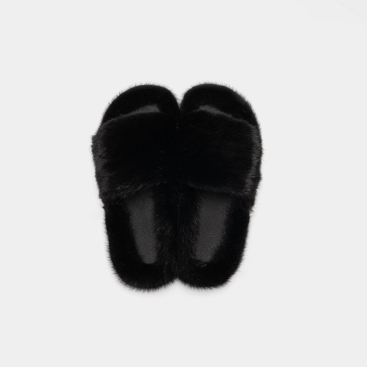 Pantofole donna nere con morbida fascia in visone, perfette per momenti di relax e lusso domestico.