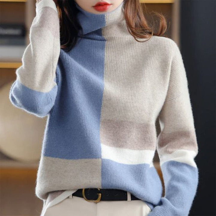 Elegante maglione donna a coste con collo alto e design color block. Comfort e stile casual-chic per ogni occasione.
