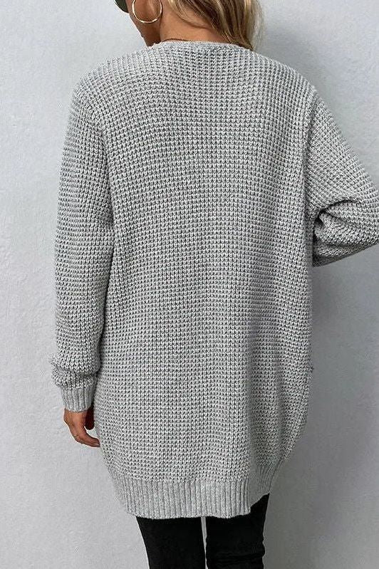 Cardigan donna moda, design aperto femminile con tasche frontali. Un capo chic per ogni guardaroba.