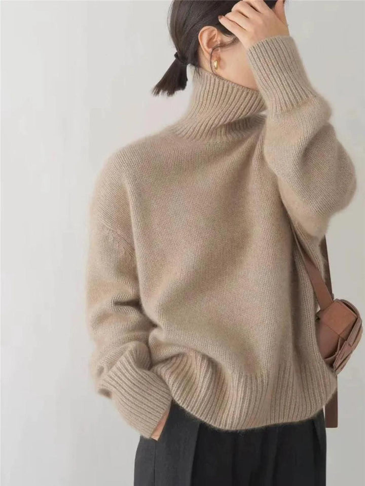 Maglione dolcevita da donna, caldo e versatile. Collo alto per comfort e stile in ogni abbigliamento.