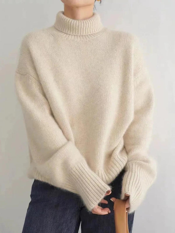 Maglione donna dolcevita a collo alto, vestibilità ampia per comfort e stile casual invernale.