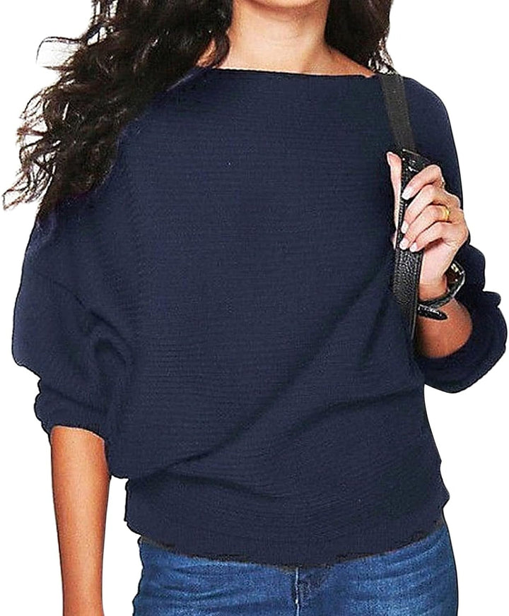 Maglia donna fluida con design elegante, maniche a pipistrello ampie e scollo a barca. Comfort e stile per ogni donna.