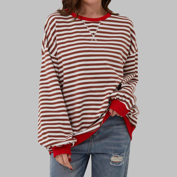 Pullover donna a righe larghe, comodo e trendy, perfetto per la stagione fredda e lo stile quotidiano.