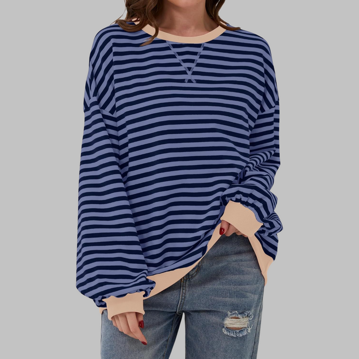 Maglione femminile oversize, con righe multicolore vibranti, un capo caldo e di tendenza.