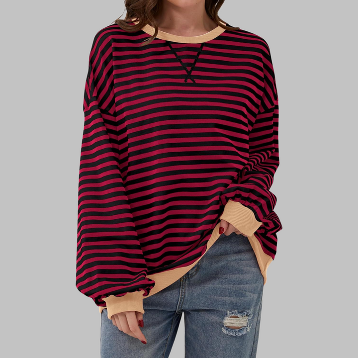 Maglione donna a righe vivaci, morbido e moderno, un pullover perfetto per un look disinvolto.