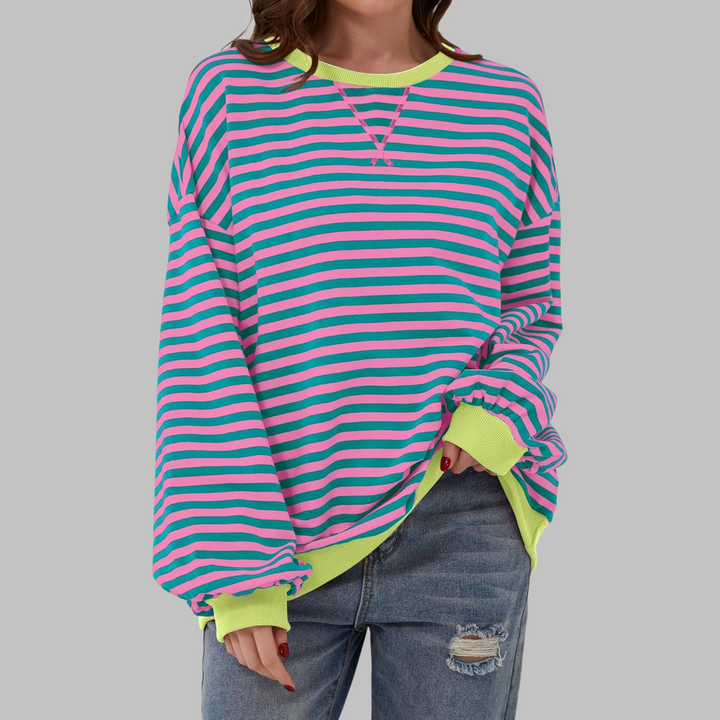 Maglione donna oversize a righe vivaci, perfetto per un look casual e confortevole autunno inverno.