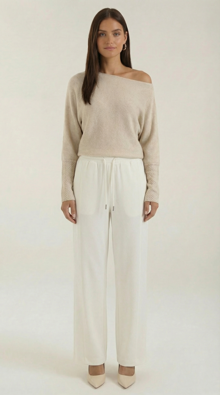 Maglione donna spalla scoperta con design asimmetrico, perfetto per look casual chic autunno/inverno.