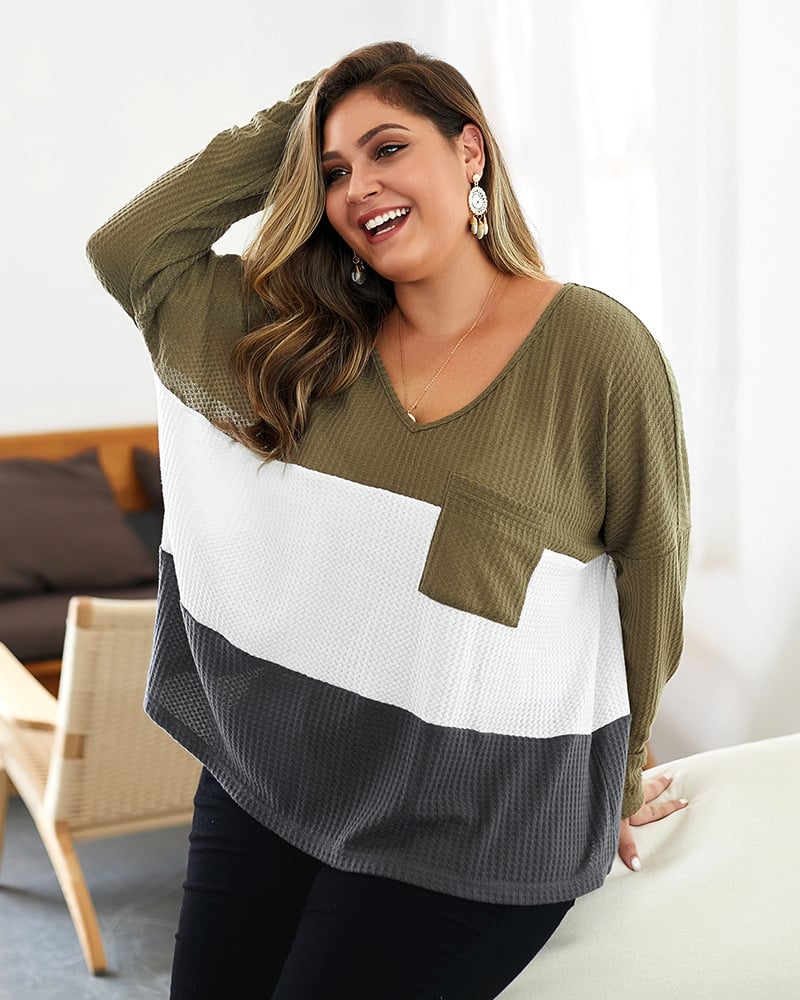Maglione donna trendy color-block con scollo a V, essenziale per la moda autunnale e invernale.