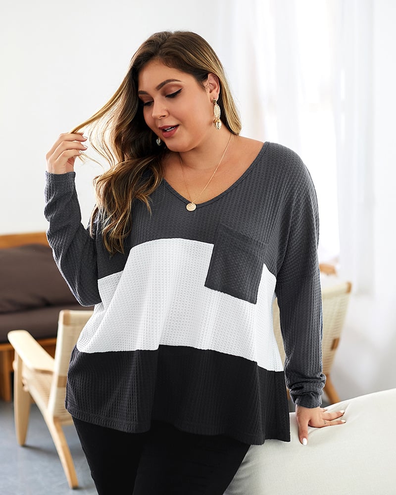 Maglione donna autunnale, design color-block, scollo a V, comfort e stile casual.