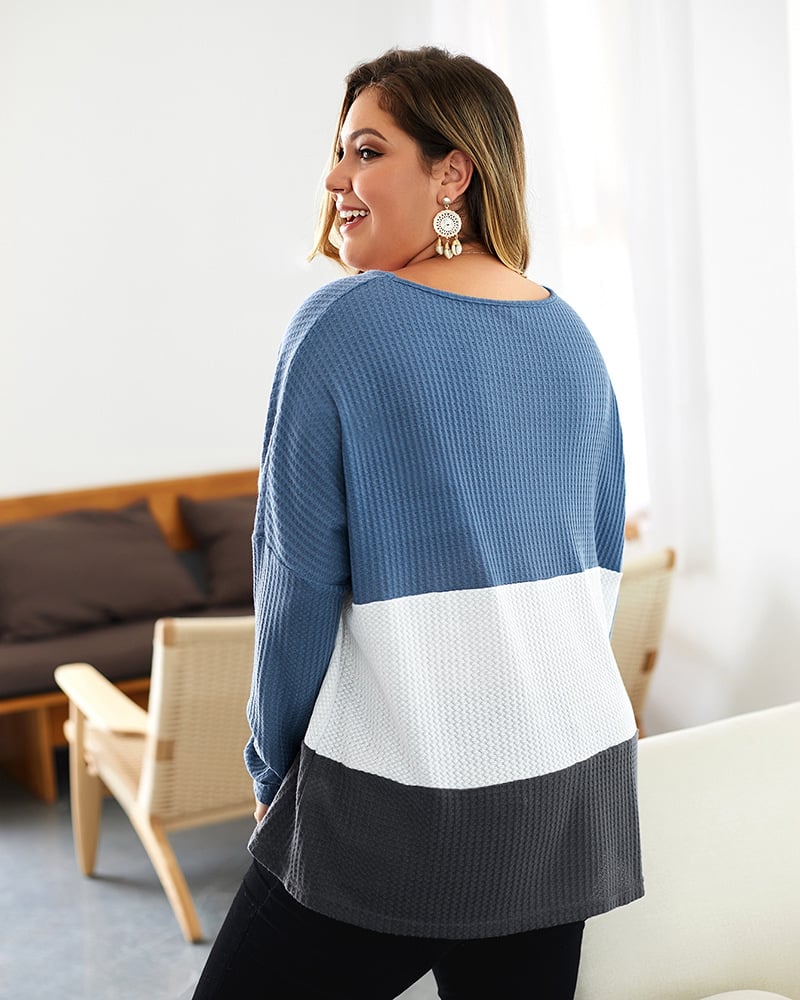 Maglione donna comodo con scollo a V e design color-block, ideale per abbigliamento casual autunnale.