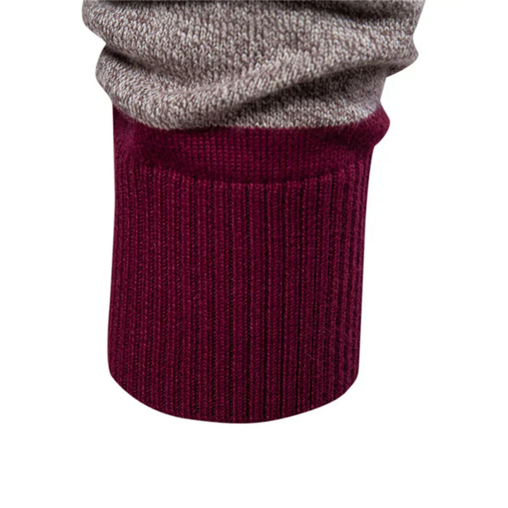 Maglione polo uomo a blocchi colore, manica lunga, in morbida maglia per massimo comfort ed eleganza.