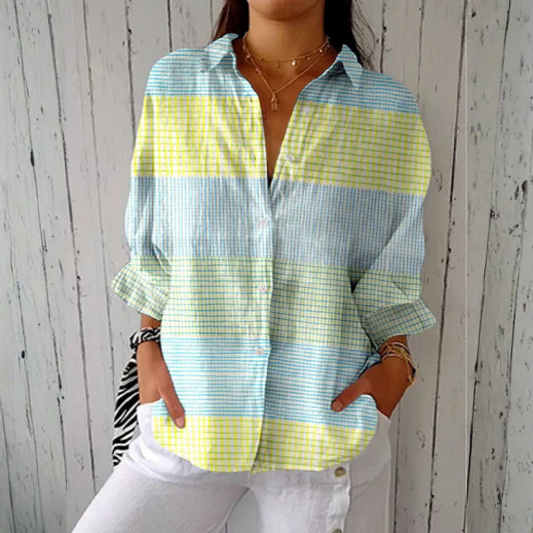Camicia donna a quadretti gialli con maniche lunghe, linea ampia. Perfetta per look casual o eleganti primaverili.