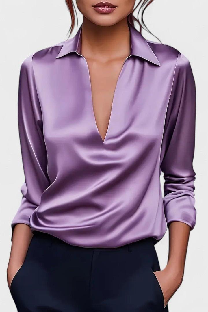 Blusa donna elegante a maniche lunghe, con profondo scollo V, per un look raffinato e femminile.