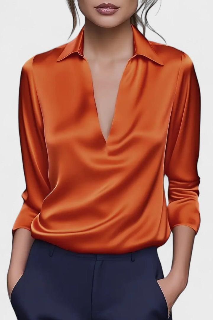 Top donna versatile a scollo V e maniche lunghe, ideale per ogni occasione e abbinamento.