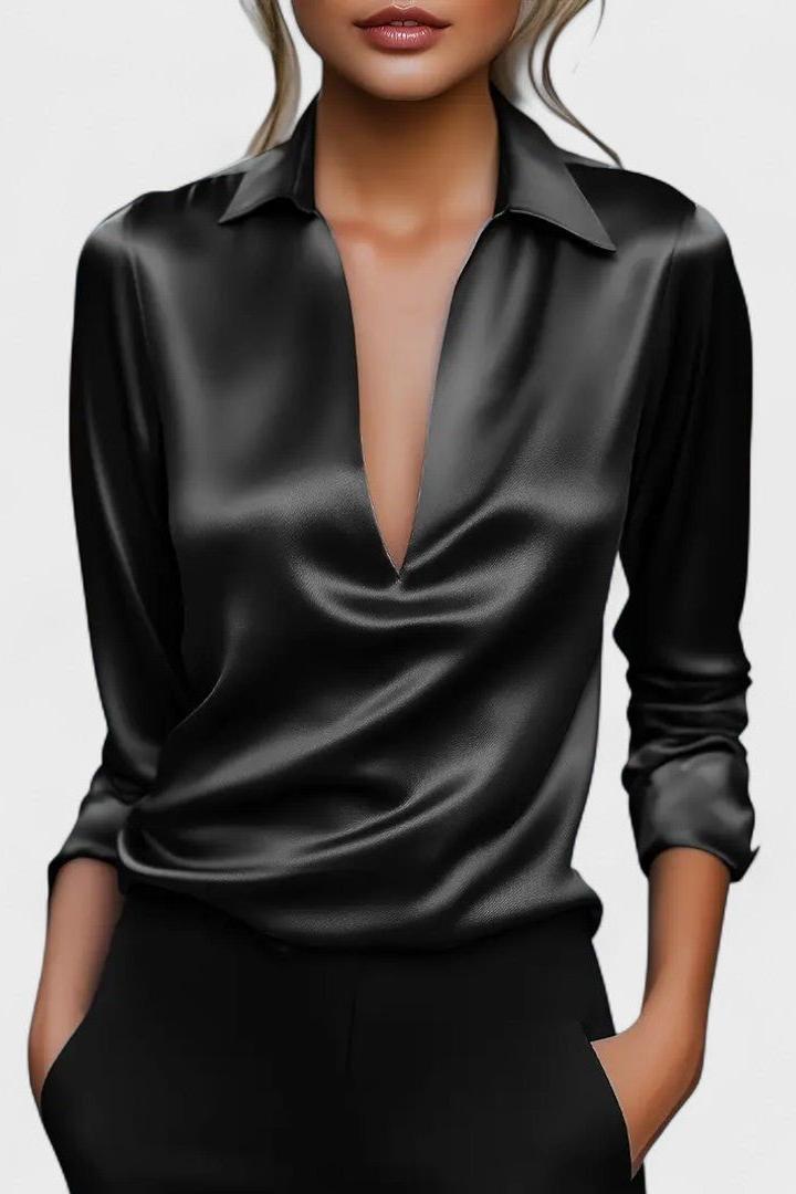 Moda donna: top a maniche lunghe con scollo V, un capo d'abbigliamento versatile ed essenziale.
