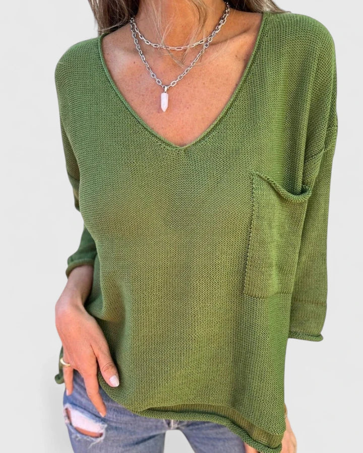 Top donna elegante nero a maniche lunghe con scollo a V. Vestibilità rilassata, perfetto per moda femminile casual.