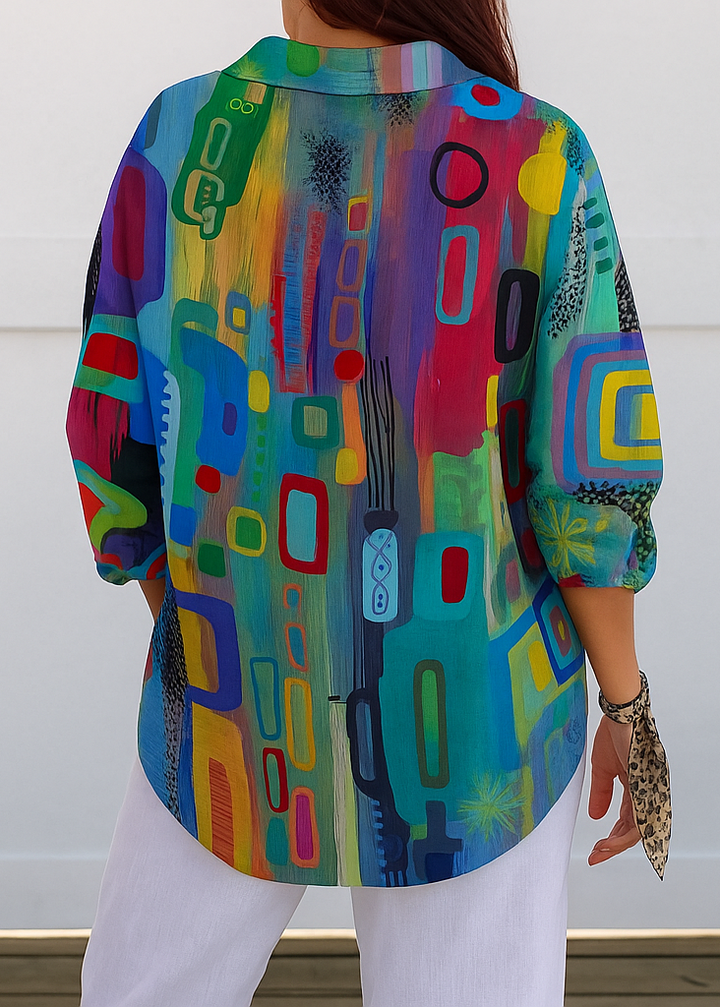Blusa donna elegante casual a maniche lunghe con stampa artistica colorata, perfetta per outfit primaverili.