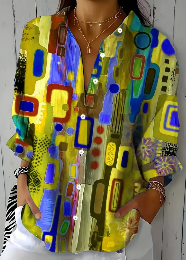 Blusa donna a maniche lunghe con stampa artistica e look vivace. Ideale per la primavera-estate, eleganza e comfort.