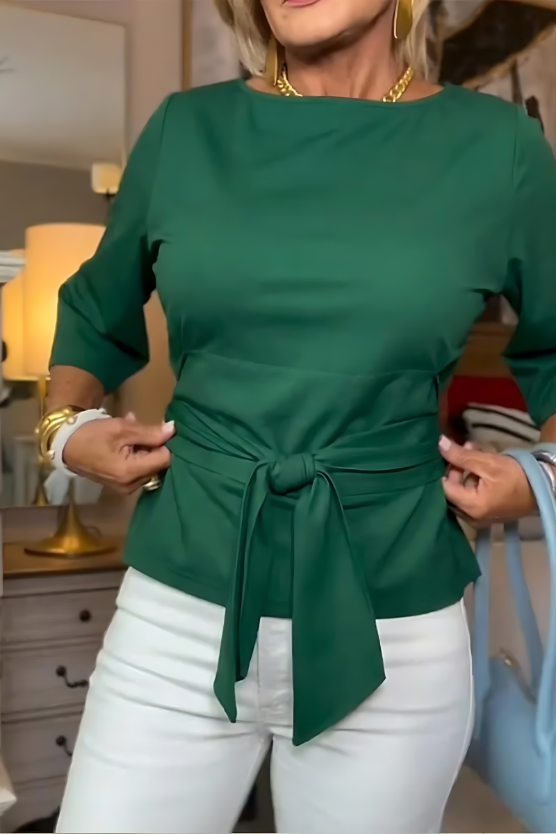 Top da donna elegante a maniche lunghe con nodo in vita. Perfetto per un outfit casual o più sofisticato.