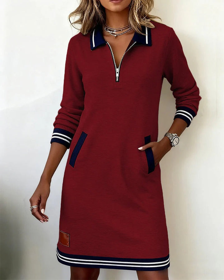 Abito midi donna con dettagli polo, mezza zip e tasche laterali, per un look moderno e funzionale.