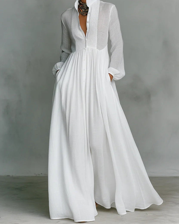 Vestito donna maxi bianco con maniche lunghe, bottoni frontali e linea fluida per look elegante e casual chic.