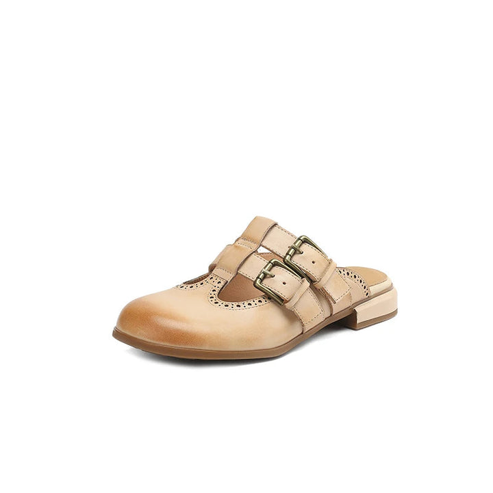 Zoccoli donna chic con fibbia e motivo brogue, scarpe casual eleganti per la bella stagione.
