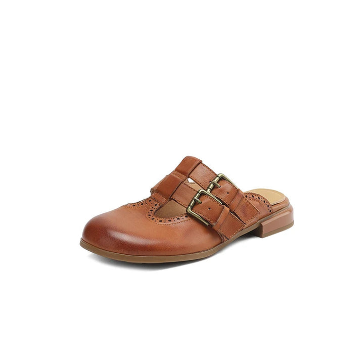 Scarpe donna zoccoli mules con fibbia, brogue e tacco basso, perfette per comfort ed eleganza.