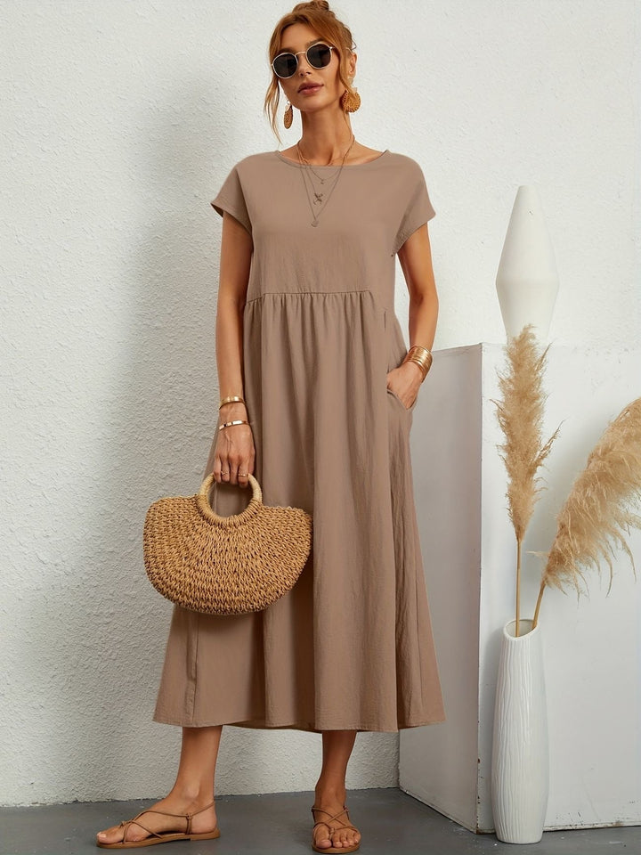 Abito midi versatile per donna, ideale per ufficio o tempo libero in estate. Casual chic.