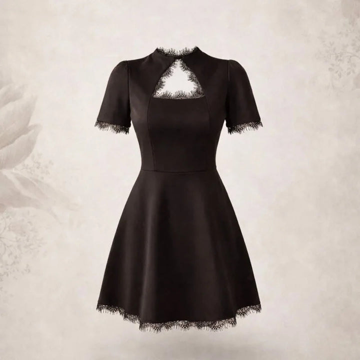 Miniabito donna aderente nero con raffinati cut-out, perfetto per serate eleganti e glamour.