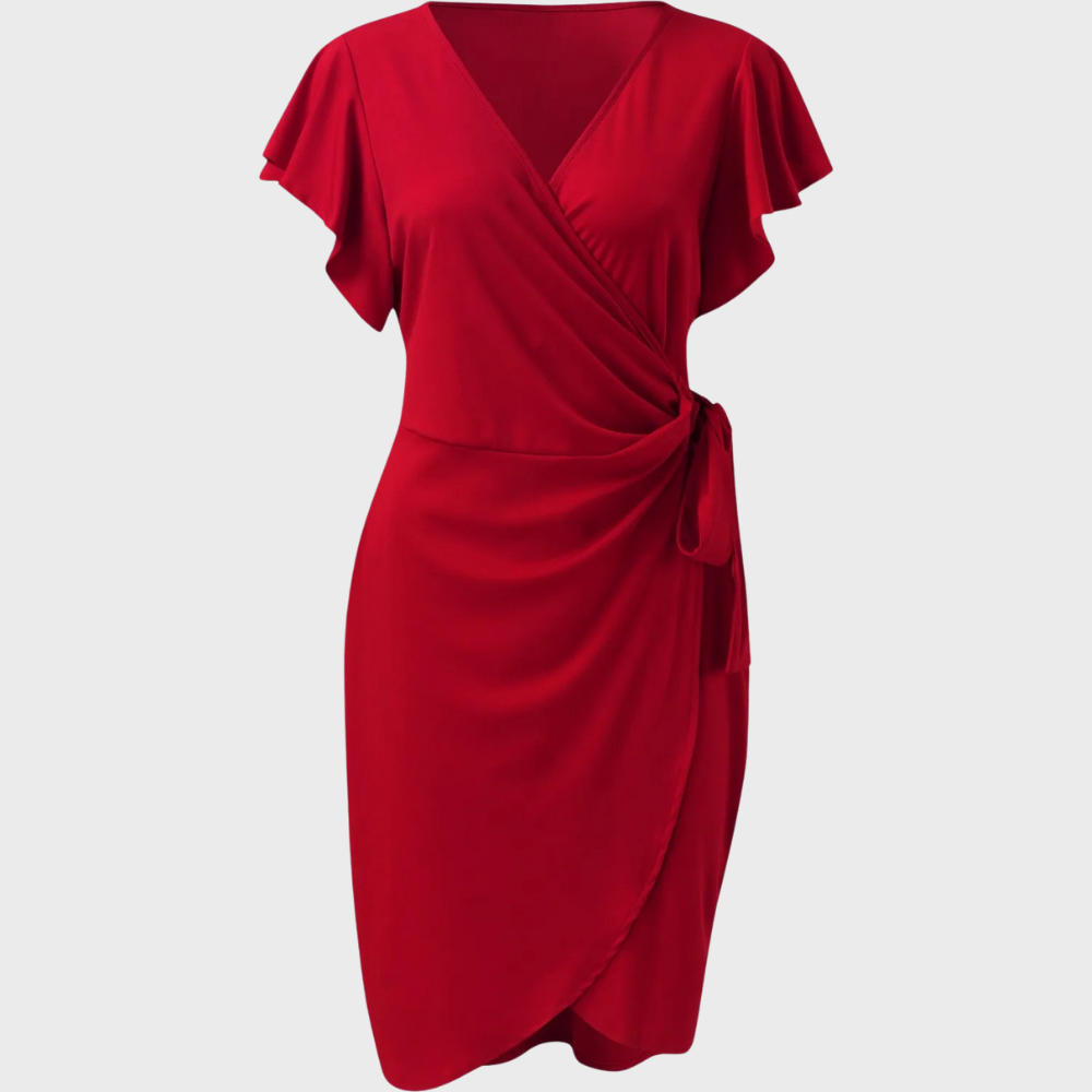Donna cammina in abito estivo midi fluido e leggero, ideale per comfort e stile senza tempo nelle giornate calde.