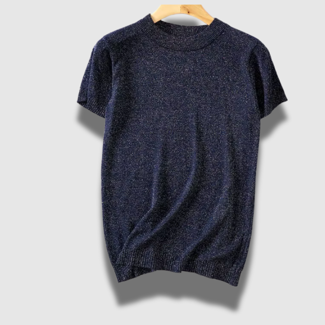 Maglione leggero donna lucido a maniche corte, offre comfort ed eleganza. Abbigliamento femminile chic.