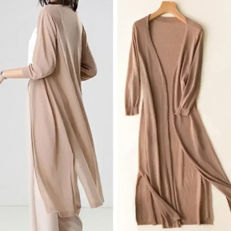 Cardigan estivo leggero da donna, aperto, con maniche 3/4. Essenziale per le serate fresche, versatile.