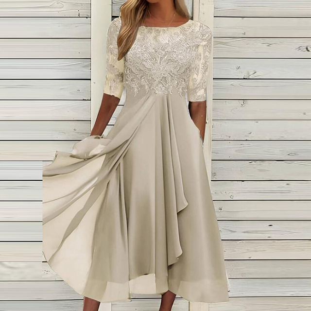 Abito donna autunnale senza maniche, comodo e fluttuante. Vestito midi ideale per l'eleganza di mezza stagione.