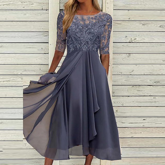 Vestito fluttuante midi senza maniche da donna. Abito autunnale versatile ed elegante per un look casual o chic.