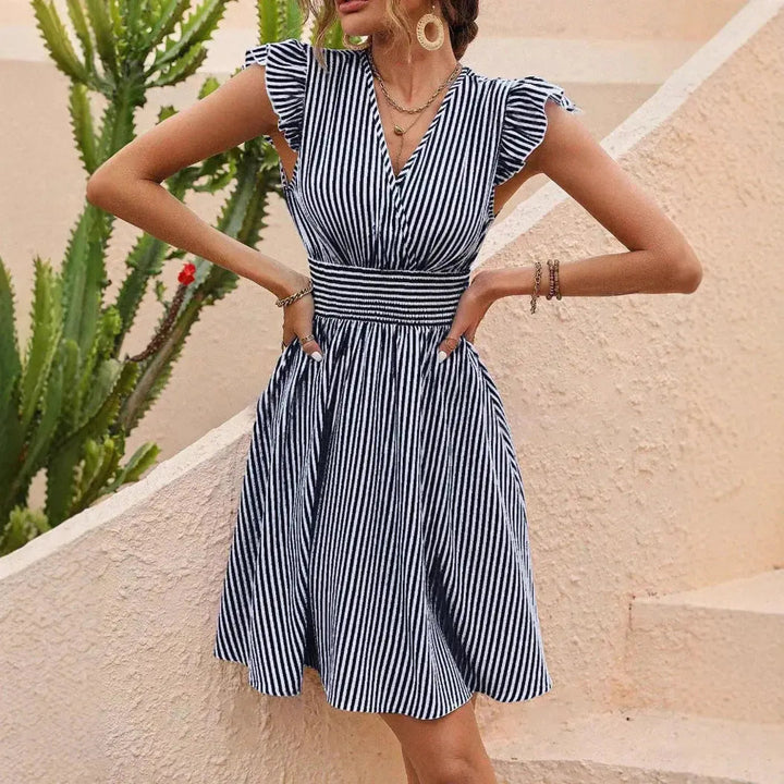 Abito midi donna elegante con scollo a V e gonna fluida. Perfetto per vacanze, cerimonie o outfit da giorno.