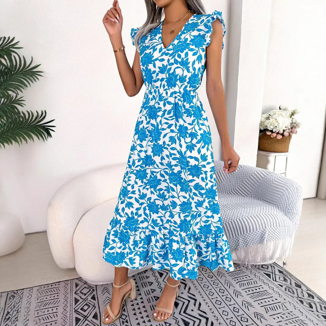 Elegante abito midi donna floreale con scollo a V e volant, ideale per feste o serate estive. Disponibile in blu/verde.