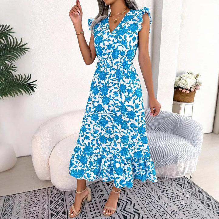 Elegante abito midi donna floreale con scollo a V e volant, ideale per feste o serate estive. Disponibile in blu/verde.