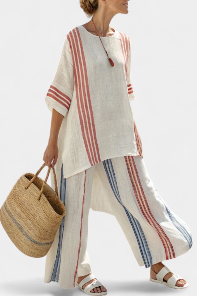 Set donna estivo a righe multicolore, completo elegante con top e pantaloni fluidi per un look coordinato chic.
