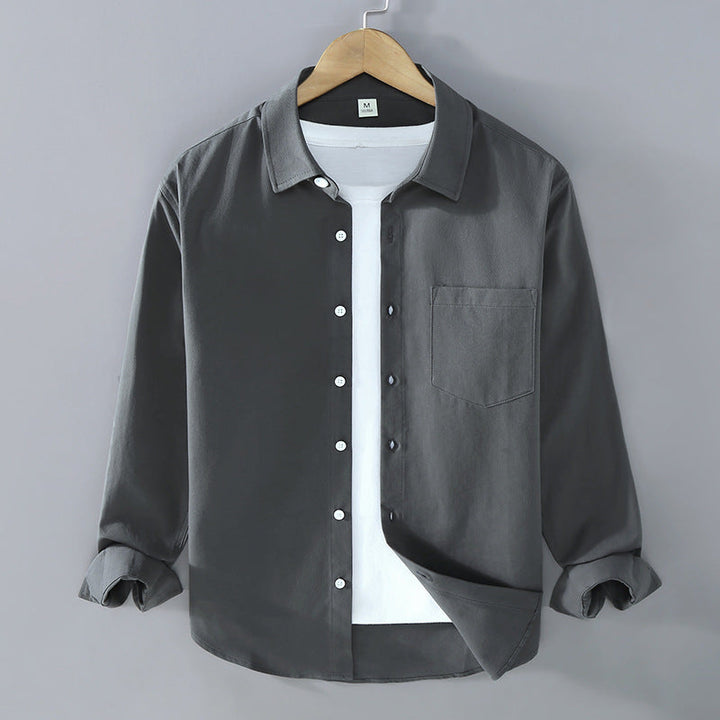 Camicia da ufficio uomo, maniche lunghe, colletto aperto. Vestibilità morbida per un comfort elegante.